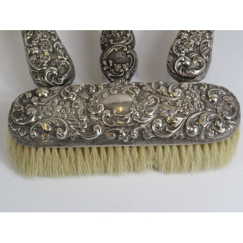 324 - 4 Sterling silver backed dressing table brushes all with hallmarks for Birmingham.