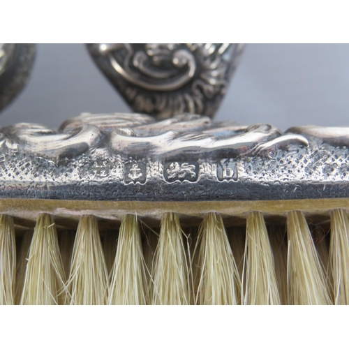 324 - 4 Sterling silver backed dressing table brushes all with hallmarks for Birmingham.