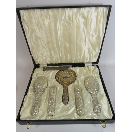 330 - Sterling silver dressing table brush, comb and mirror set in original box and appears to be unused. ... 