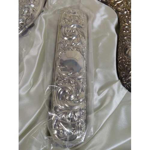 330 - Sterling silver dressing table brush, comb and mirror set in original box and appears to be unused. ... 