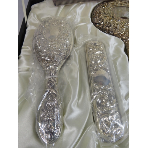 330 - Sterling silver dressing table brush, comb and mirror set in original box and appears to be unused. ... 