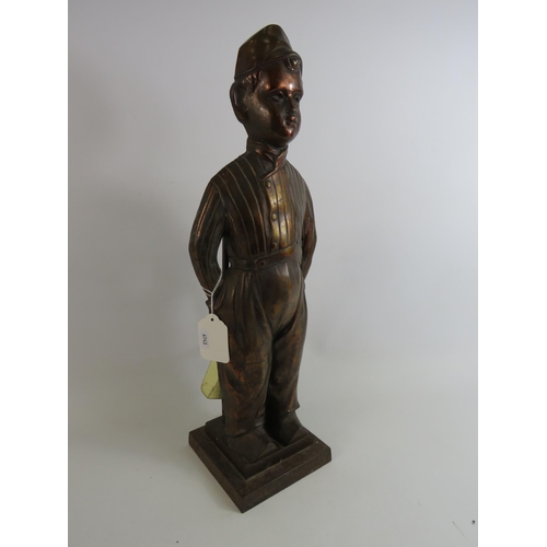 35 - Vintage Bronze effect cast fire side companion set in the form of a boy which stands approx 20.5