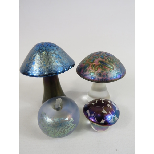 9 - 3 Iridescent toad stool paperweights and one in the form of an apple.