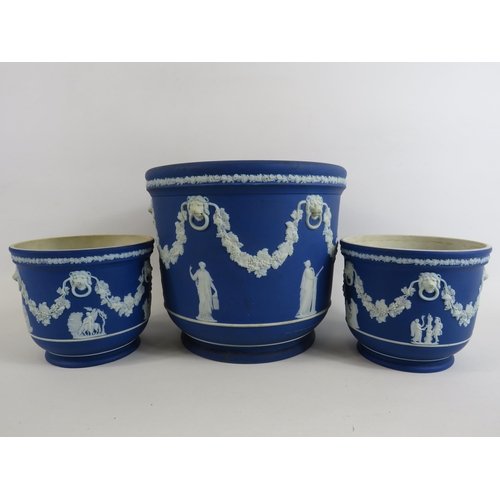 65 - 1 large and 2 small dark blue Wedgwood Jasperware planter. The largest measures 7 1/4