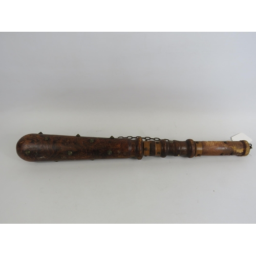 110 - Decorative vintage wooden club with spikes.