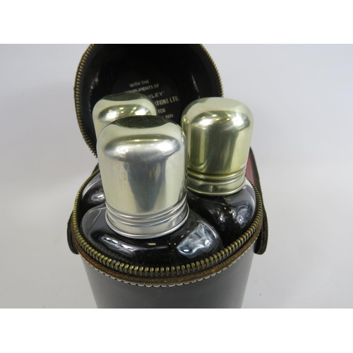 95 - Vintage Beefeater triple flask set in leather case.