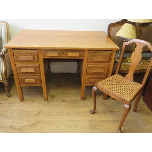 713 - Early 20th Century Solid Oak desk along with a bergere seated chair of similar construction and mate... 