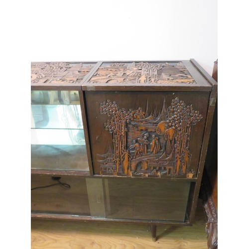 723 - Mid 20th Century Chinoserie carved sideboard with glass doors, carved door and tops. Side door will ... 