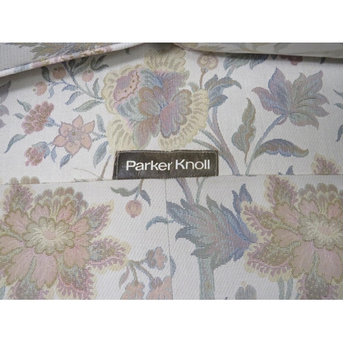 752 - Parker Knoll Two seat settee upholstered in a floral and leaf pattern. Very clean condition. See pho... 