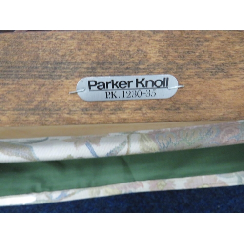 753 - Parker Knoll Spring loaded rocking chair upholstered in a floral and leaf pattern. Very clean condit... 