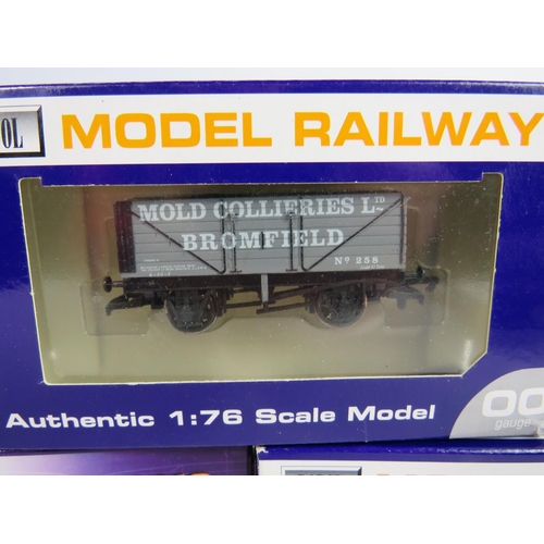 134 - Three Dapol 00 Scale, Seven and Five plank Trucks all boxed and unused condition. See photos.