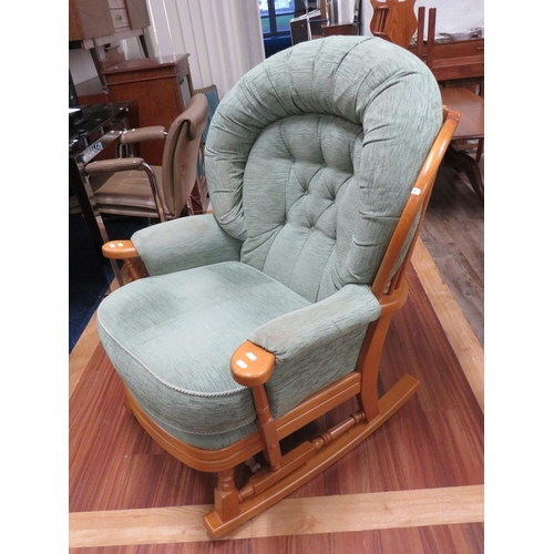 767 - Comfortable modern stick back rocking chair. See photos.