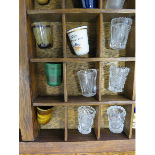 126 - Large wooden thimble display case and various thimbles including glass, souviner, metal etc.