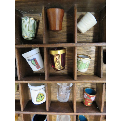 126 - Large wooden thimble display case and various thimbles including glass, souviner, metal etc.