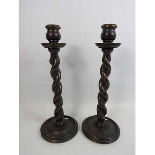 186 - Pair of oak barley twist candlesticks which stand approx 12.5