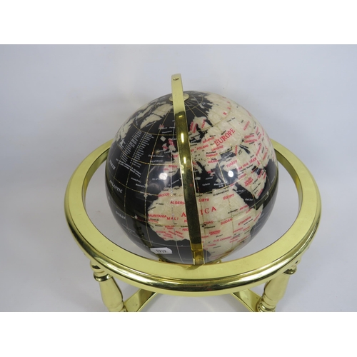 195 - Table top semi precious stone globe on a gold stand, approx 13