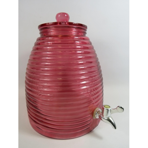 226 - Large pink beehive shape glass drinks dispenser. 12.5