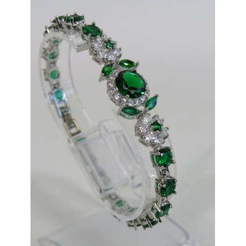 290 - 925 silver bracelet set with Emeralds and Topaz.