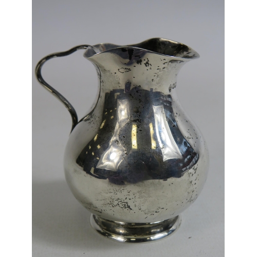 309 - Sheffield sterling silver jug. 78.1 grams.