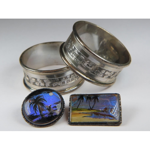 527 - Matched pair of Hallmarked Silver serviette rings together with two Silver backed Butterfly wing bro... 