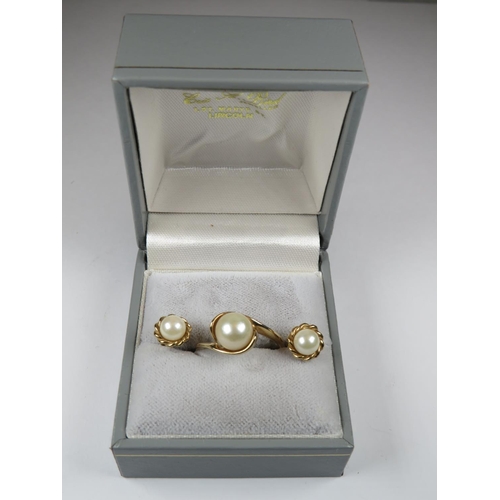 530 - 9ct Yellow Gold pearl set ring. Finger size 'N'   3.1g together with a matched pair of 9ct yellow go... 