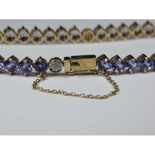 535 - Beautifully made 9ct Tanzanite bracelet interspersed with Diamond clusters. All set on 9ct Yellow go... 