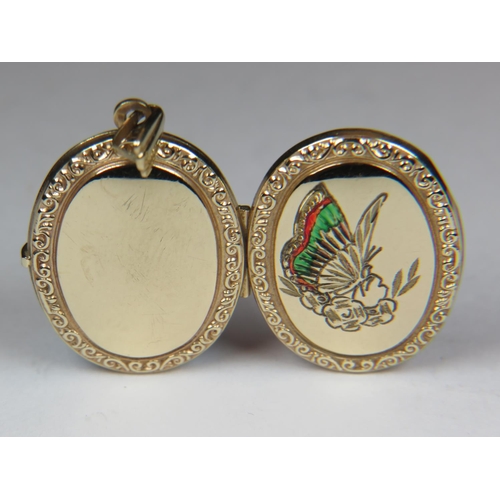 536 - Lovely 9ct Yellow Gold locket, engraved with a butterfly and flowers. Total weight 3.2g