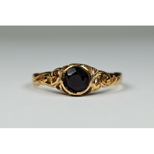 407 - 9ct Yellow Gold garnet set ring with pierced shoulders. . Finger size 'U-5'  2.5g