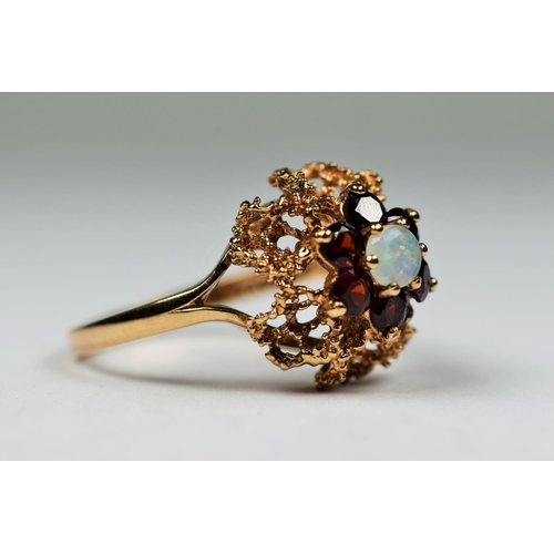 409 - 9ct Yellow Gold Poal and Garnet set ring in a basket setting. Finger size 'O'  3.6g