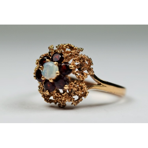 409 - 9ct Yellow Gold Poal and Garnet set ring in a basket setting. Finger size 'O'  3.6g