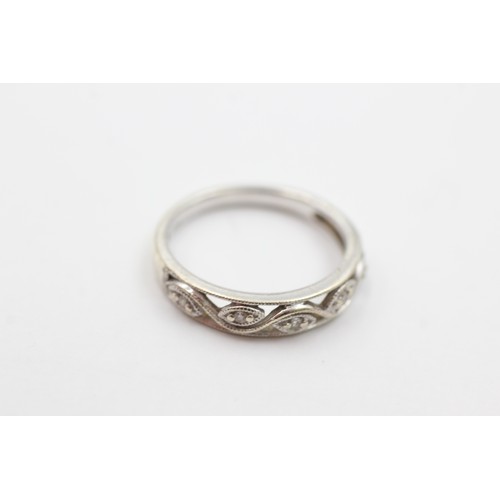 422 - 9ct white gold diamond set stylised floral openwork eternity ring (2.4g)     734649