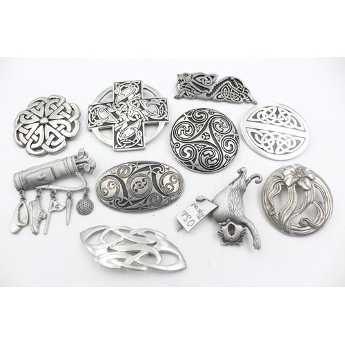 465 - 10 x assorted pewter brooches including signed j.j and st justin (204g)     575389