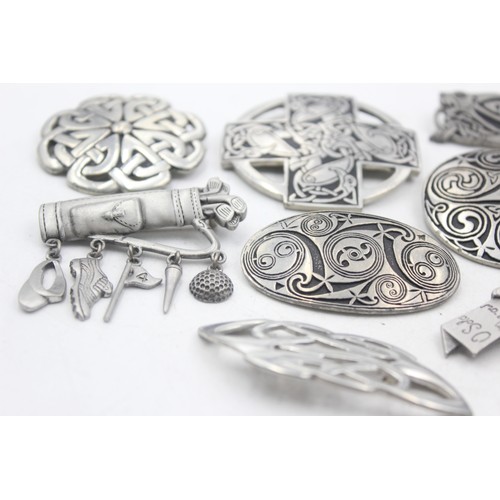 465 - 10 x assorted pewter brooches including signed j.j and st justin (204g)     575389