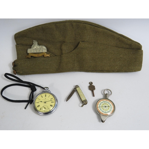 332 - Military Field service cap with Lincs Reg Cap badge,  A German opsimeter map measurer, A pocket watc... 