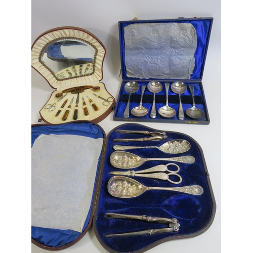 655 - Cased vintage manicure set and 2 serving spoon sets.