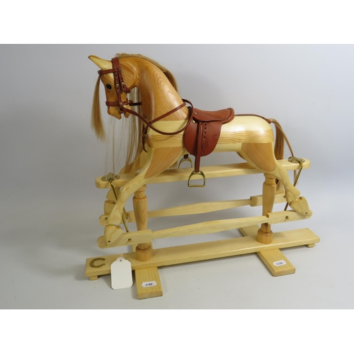 673 - Beautifully handmade miniature wooden rocking horse with leather tack. 15.5