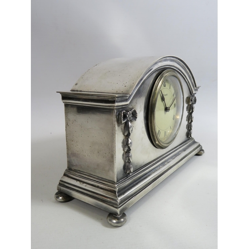 679 - Vintage French silverplated mantle clock which sits on bun feet. 6 1/4