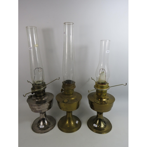 683 - 3 Aladdin vintage oil lamps with chimneys.