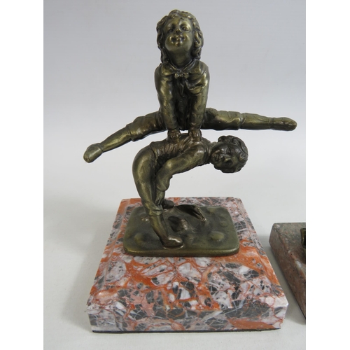 690 - 2 Small bronze effect sculptures of children on marble bases. The tallests is 6.5