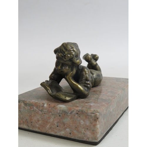 690 - 2 Small bronze effect sculptures of children on marble bases. The tallests is 6.5