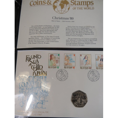 554 - Two well presented albums of Coins and stamps of the world.  See photos.