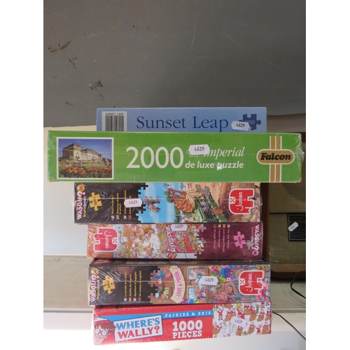 943 - 6 Jigsaw puzzles all new in cellophane.