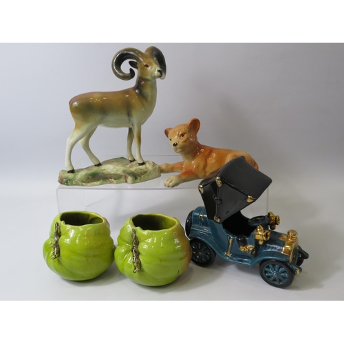 691 - Selection of Bretby art pottery, Lion cub, apples, car and a mountain goat which has damage to one h... 