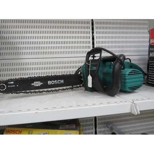 1064 - Bosch electric chain saw. Working condition unknown plus a B&Q mitre saw kit in box. See photos.