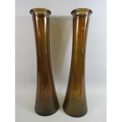 22 - Two tall and Heavy brown coloured glass vases approx 22