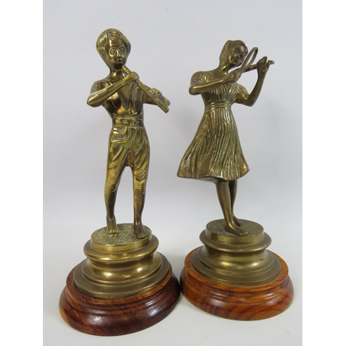 23 - 2 Brass musician Figurines on wooden bases approx 11 inches tall.