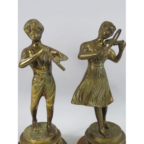 23 - 2 Brass musician Figurines on wooden bases approx 11 inches tall.