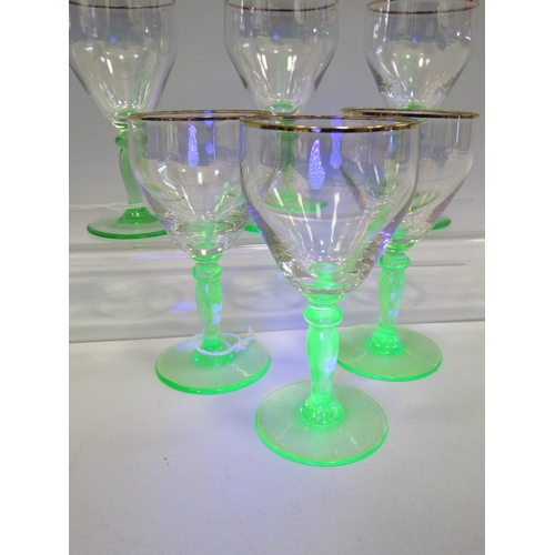 64 - 6 Vintage small wine glasses with green uranium stems.