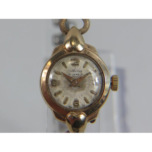 402 - Avia, 15 Jewel ladies  watch with yellow metal expanding strap.  9ct case. Running order. See photos... 