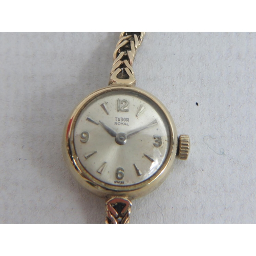 403 - Rolex Tudor ladies watch with 9ct Yellow Gold case and strap.  Intermittent runner. 11.1g